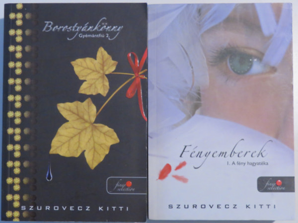 Szurovecz Kitti: 2 db Szurovecz Kitti-kötet: Fényemberek I. - A fény hagyatéka; Gyémántfiú 2. - Borostyánkönny antikvár